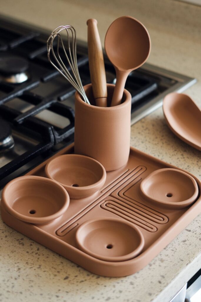 Clay tool rest with drip-catching channels and utensil holders