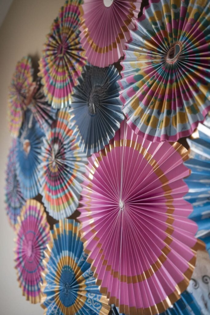 Colorful paper fans folded accordion-style for a party backdrop