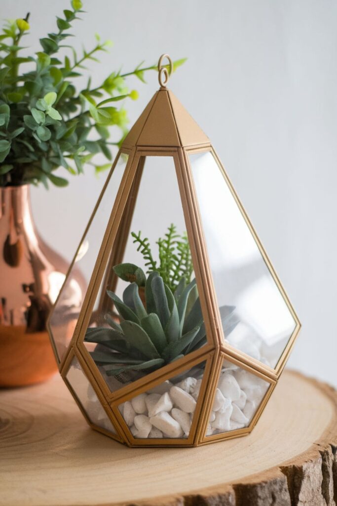 Decorative cardboard terrarium with geometric shapes and copper-painted accents