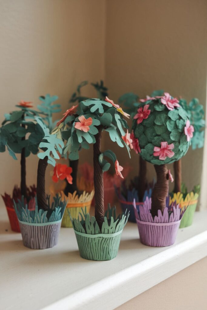 Realistic paper topiary plants in colorful pots on a windowsill