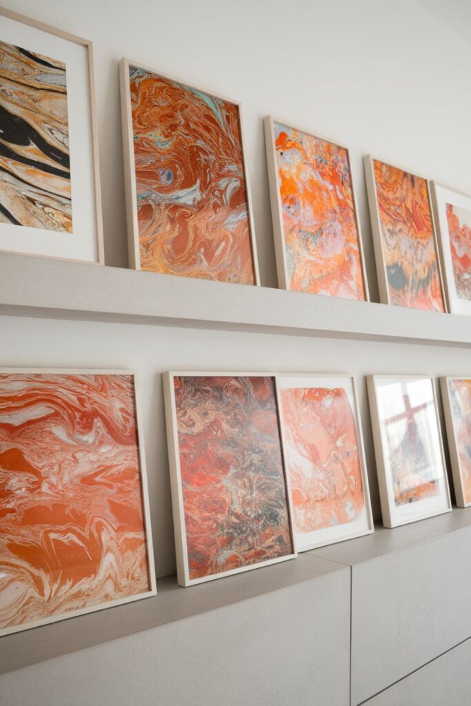 Vibrant marbled paper sheets with swirling patterns