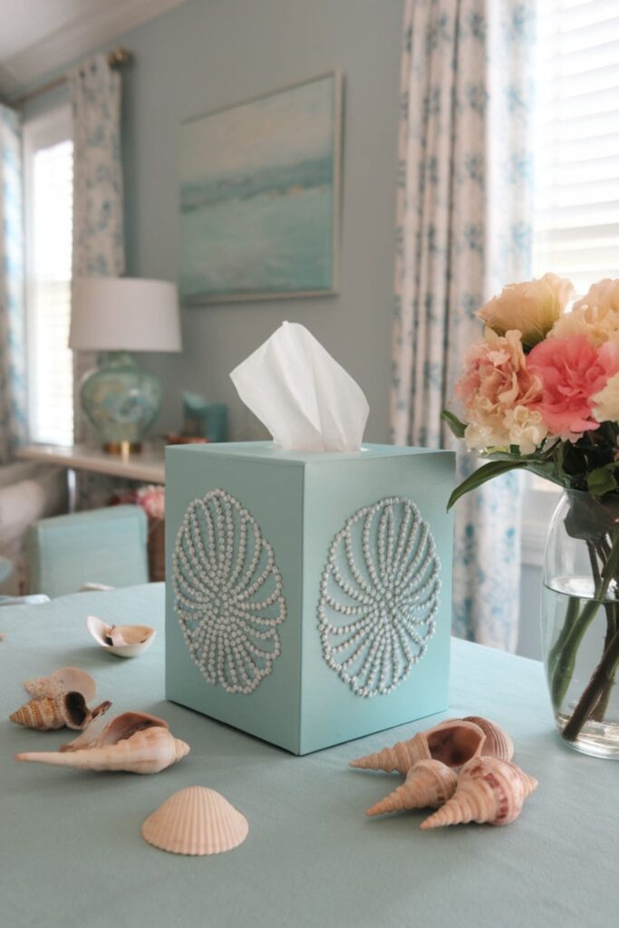 Blue tissue box cover with elegant patterns on a table in a coastal-themed room