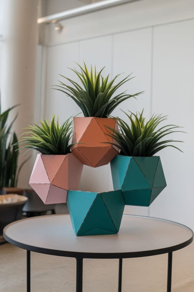 Cardboard hanging planter with geometric shapes and plants on a table