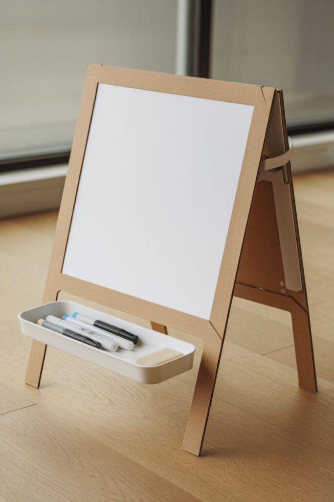 Cardboard whiteboard stand with a marker tray