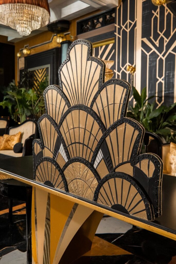 Gold and black Art Deco hot glue fan patterns on a table