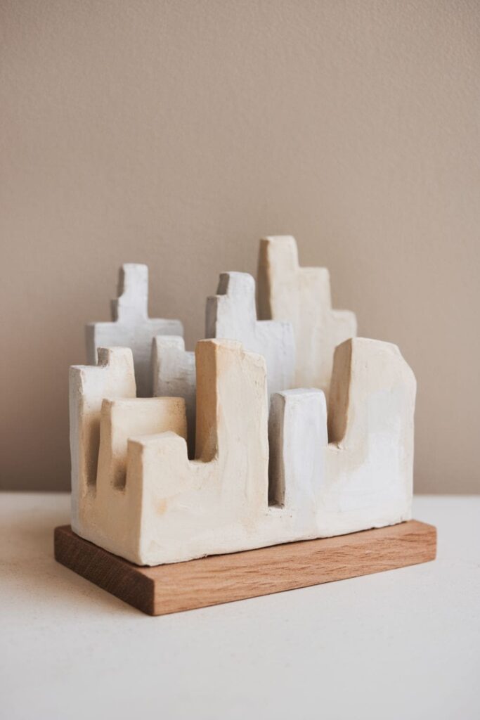 Mini clay cityscape with layered buildings