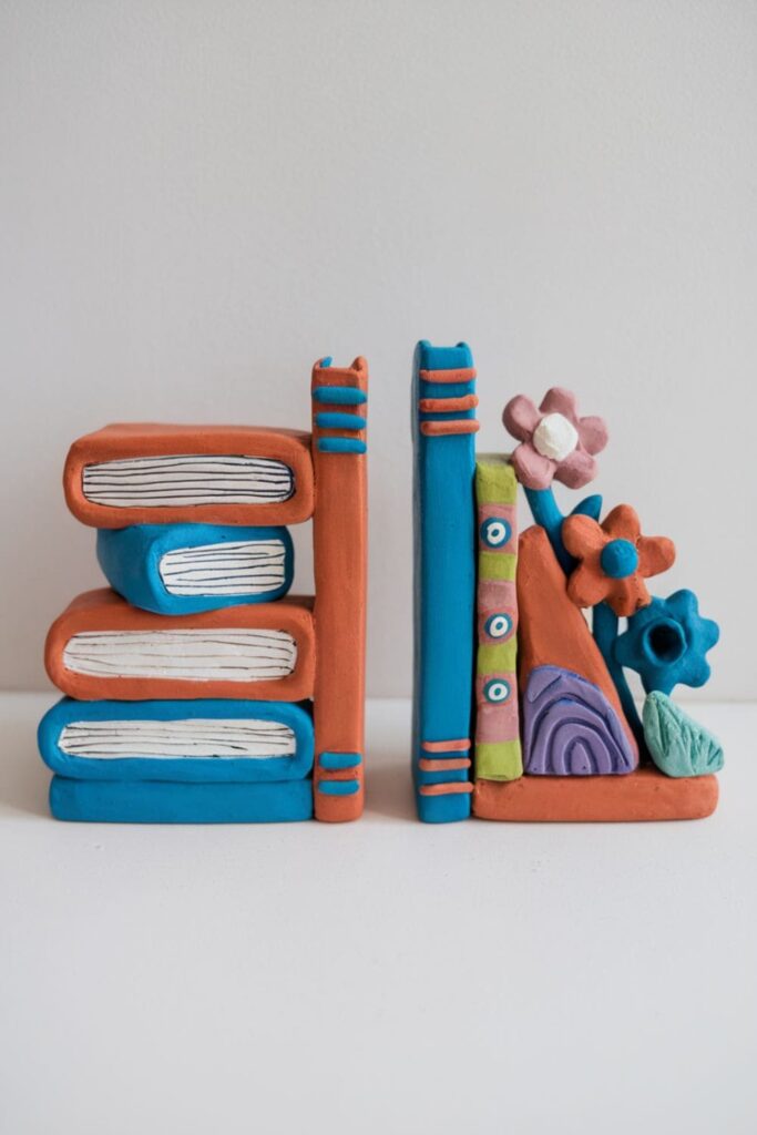 Sturdy clay bookends with vibrant, decorative designs