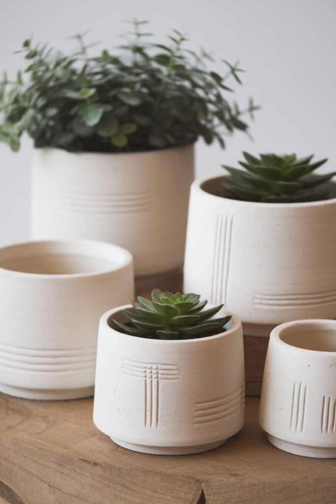 White clay plant pots with subtle geometric patterns